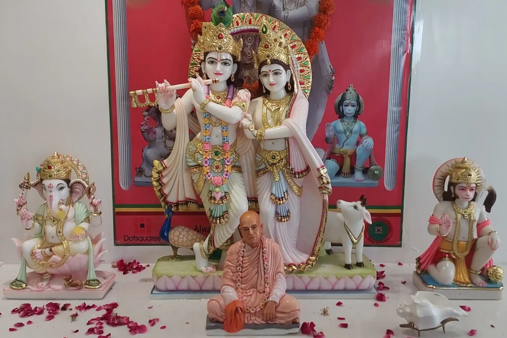 Radha Krishna marble murti installation crafted in Jaipur with detailed hand-painted ornaments and temple backdrop
