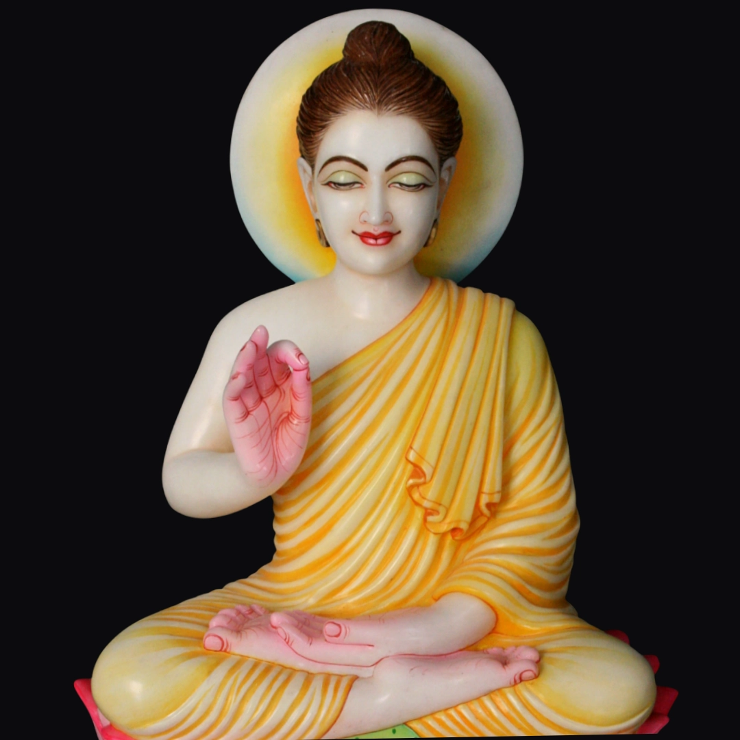 White Marble Buddha Statue – Shilpagya Jaipur Hand-carved white marble Buddha statue in meditation posture with yellow robe and halo, crafted in Jaipur