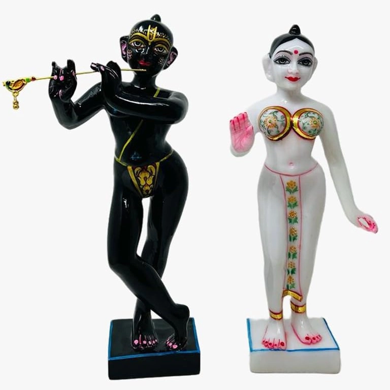 White marble Iskcon Radha Krishna murti with traditional ornaments carved in Jaipur